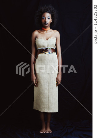 Fashion, beauty and portrait of African woman on dark background with confidence, style and pride. Culture, aesthetic and isolated person with cosmetics, trendy accessories and makeup in studio 114325502