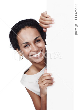 Studio, blank poster and woman with mockup space, introduction and isolated on white background. Signage, business offer and happy female person with billboard for news, announcement and deal info 114325582