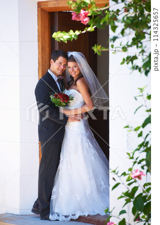 Happy couple, portrait and hug at wedding for marriage, love or honeymoon in commitment together. Married man or groom hugging woman or bride smile in embrace, loyalty or support in trust at ceremony 114325657