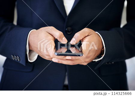Businessman, hands and smartphone in office for typing, browsing and texting online with contact. Technology, connectivity and male person with cellphone for networking, social media or salesman 114325666