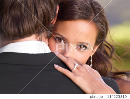 Bride, portrait and embrace on wedding day for love, support and together for marriage and commitment. Couple, romance and hugging at outdoor ceremony, loyalty and ring for devotion and partnership 114325810