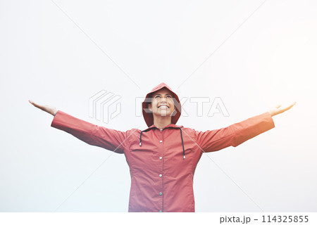 Happy woman, rain jacket and freedom with hood for weather, cloudy sky or winter season in outdoor storm. Female person with smile in red waterproof raincoat for overcast, fog or snow on mockup space Happy woman, rain jacket and freedom with hood for weather, cloudy sky or winter season in outdoor storm. Female person with smile in red waterproof raincoat for overcast, fog or snow on mockup space 114325855