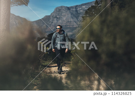 Hiking, man and path in the mountains with eco travel, trekking and camping adventure with backpack. Vacation, trees and summit for exercise, fitness and training outdoor on Peru holiday in nature 114326825