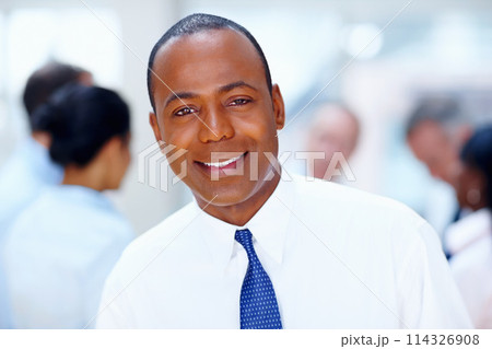 Happy, meeting and portrait of business black man with team for collaboration, leadership and management. Corporate worker, company and face of boss for professional career, job and work in office 114326908