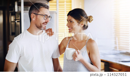 Couple, kitchen and coffee in the morning with smile, bonding and spending time together. Love, trust and commitment with marriage partner, communication and happiness with hot drink at home 114327051