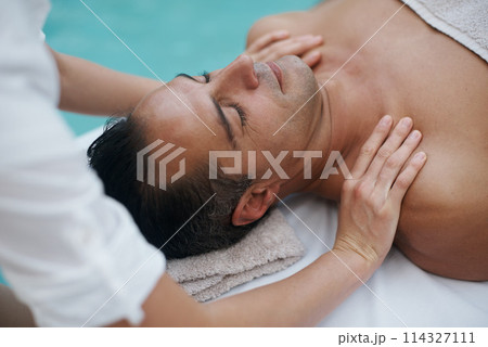 Spa, man and hands with massage for skincare at resort, luxury hotel and vacation for relax and therapeutic pamper. People, masseuse and body care with shoulder treatment, hospitality and zen outdoor 114327111