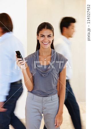 Businesswoman, portrait and phone with hand in busy office with communication for company with research. Female person, mobile and work with screen for brand, taking and call in profession with tech 114327452