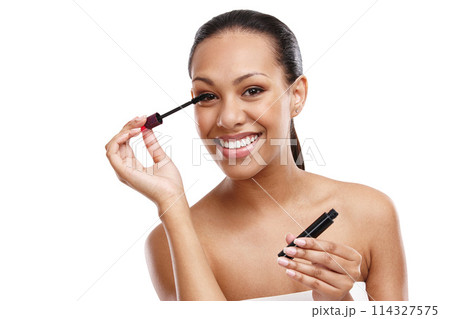 Woman, portrait and cosmetics in studio with mascara, beauty and smile for makeup by white background. Happy, tool and face of female model for aesthetic with volume, product and skin by backdrop 114327575