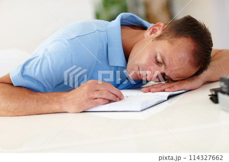 Tired, businessman or notebook in mental health, burnout or sleeping, fatigue or bad dream at desk. Brain fog, man or overworked to fail, overwhelmed or worried at burden, toxic or stress of business 114327662