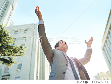 Business man, city and freedom or celebration for career success, winning and wow with arms up in sky. Low angle of a corporate worker or lawyer excited for opportunity, news and bonus or promotion 114328234