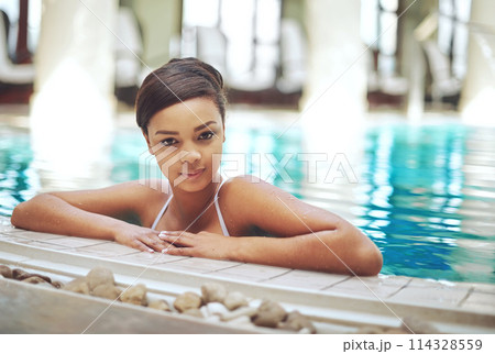 Vacation, calm and pool for swimming, black girl and smile for fun, travel and happy in water, clean and blue in resort. Outdoor, tourist and person in holiday, trip and hotel for summer in Maldives 114328559