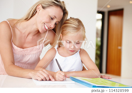 Parent, happy and girl writing in book for development, learning or educational growth. Mom, smiling and child studying notebook in living room together for homework, examination or schoolwork 114328599
