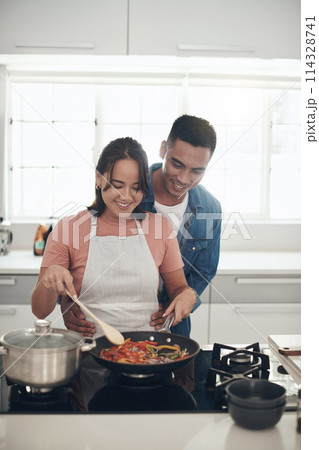 Help, cooking and couple in kitchen together with healthy food, relationship and bonding in home. Diet, hungry man and happy woman in apartment with nutrition, care and meal prep for lunch with love 114328741