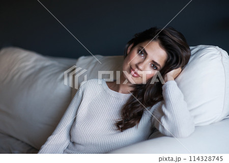 Portrait, woman and couch with break, confidence and style with lounge or sofa. Person, sweater and proud with elegant, relaxation and rest with youth and face in living room at house or home 114328745