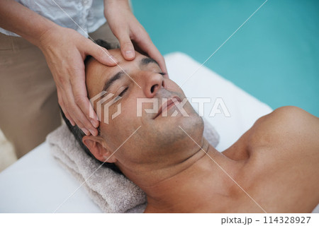 Resort, spa and man relax for massage on table in hotel, calm and care for body in vacation. Holiday, luxury and male person on break for weekend, accommodation and lodge with treatment for skincare Resort, spa and man relax for massage on table in hotel, calm and care for body in vacation. Holiday, luxury and male person on break for weekend, accommodation and lodge with treatment for skincare 114328927