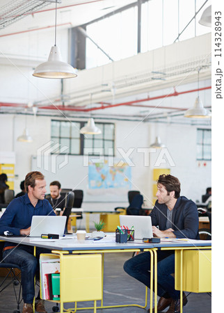 Men, business and workers with laptop for teamwork, partnership or collaboration for digital search in company. Office, workspace and startup with technology, creative and online website design 114328943