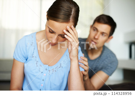 Couple, stress and fight in home with argument or angry with apology and sad in disappointment. Relationship, confrontation and marriage issues in living room on couch with conflict and emotions. 114328956