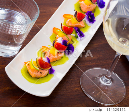 Delicious canapes with marinated salmon Delicious canapes with marinated salmon 114329131