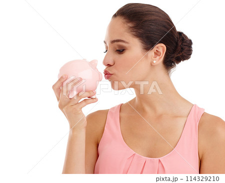 Kiss, piggy bank and woman in studio for budget, finance or investment safety. Face, container or person with money box for savings, income or security of future profit isolated on a white background 114329210