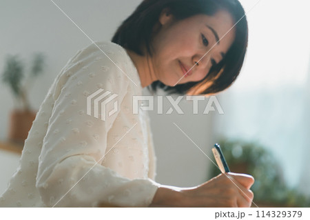 a forty-something woman a forty-something woman 114329379