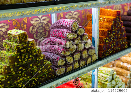 Sweet Turkish delight on showcase in confectionery shop Sweet Turkish delight on showcase in confectionery shop 114329665