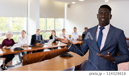 Portrait of confident businessman inviting on meeting Portrait of confident businessman inviting on meeting 114329818