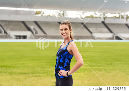 Girl, athlete and happy portrait in stadium for long distance running or sprinting for athletics and training. Female runner, confident and positive for track or field events for olympics in Paris. Girl, athlete and happy portrait in stadium for long distance running or sprinting for athletics and training. Female runner, confident and positive for track or field events for olympics in Paris. 114329836