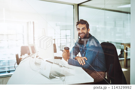Man, technology and office portrait with coffee, lens flare and startup business. Morning light, entrepreneur face and creative job by desk with computer, reading email and online work for web design 114329992