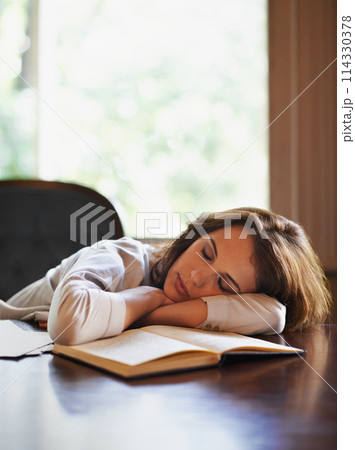 Sleep, remote worker and tired woman with books, fatigue or snooze while writing in home office. Freelance, burnout or female writer nap in a house exhausted by reading, research or novel notes 114330378