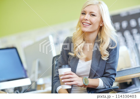 Woman, office and employee with happiness in desk as hr manager with coffee for break and relax. Portrait, female person and smile with commitment for job, career growth and opportunity at work. 114330403