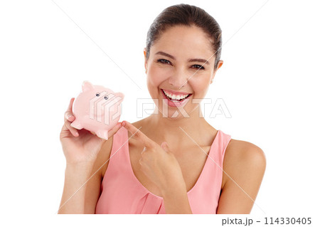 Portrait, happy woman and pointing at piggy bank for budget, finance or invest in studio. Face, smile or person with money box for savings, income or security of profit isolated on a white background 114330405