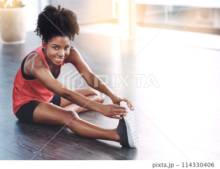 Smile, black girl and stretching for workout in home to exercise for health or fitness. Portrait, warm up and floor with confidence or happy for gym or training, wellbeing and wellness with self care 114330406