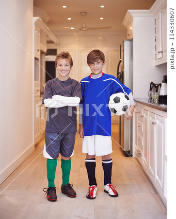 Children, friends and portrait with soccer ball at house or training game in kit or competition, cardio or apartment. Male people, face and football in kitchen or player practice, exercise or workout Children, friends and portrait with soccer ball at house or training game in kit or competition, cardio or apartment. Male people, face and football in kitchen or player practice, exercise or workout 114330607