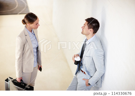 Businessman, businesswoman and conversation with coffee, office and briefcase in workplace. Businesspeople, employees and company in business, sector and corporate for collaboration or discussion Businessman, businesswoman and conversation with coffee, office and briefcase in workplace. Businesspeople, employees and company in business, sector and corporate for collaboration or discussion 114330676