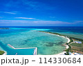 【沖縄・宮古島】狩俣漁港上空から池間島、池間大橋、青い海をドローンで撮影② 114330684