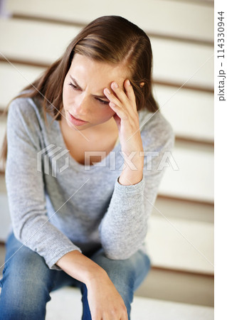 Stress, headache and woman in house with confused, frustrated or mental health, crisis or disaster. Stairs, doubt or angry female person with broken heart overwhelmed by anxiety, fail or mistake 114330944