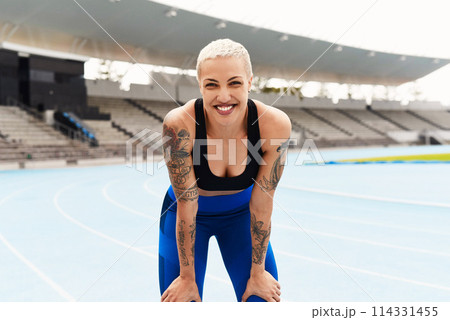 Woman, portrait and athlete with confidence on track field for health, wellness and running. Female runner, happy and workout with smile for training, exercise and fitness with future athletic event 114331455