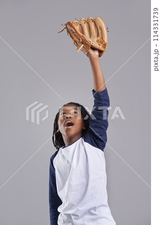 Sports, baseball and child on gray background with glove for training, practice and match. Fitness, youth and excited young boy with equipment for exercise, playing games and training in studio 114331739