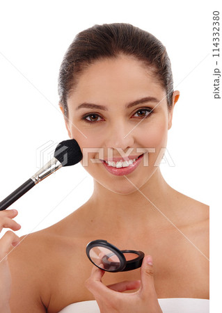 Woman, portrait and brush for blush in studio, makeup and foundation powder on white background. Female person, smile and apply cosmetics for beauty, makeover and transformation or tool for treatment 114332380