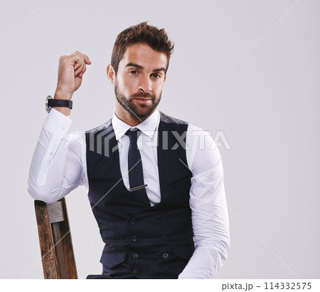 Studio, portrait and confident employee with chair, man and worker for corporate company, pride and stylish. Adult, male person and guy in suit for aesthetic, fashion and smile in white background Studio, portrait and confident employee with chair, man and worker for corporate company, pride and stylish. Adult, male person and guy in suit for aesthetic, fashion and smile in white background 114332575