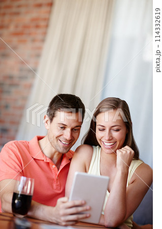 Couple, relax and smile in home with tablet for streaming online for movies or films, videos and social media memes. Man, woman and together with hug for bonding or love with affection and support. Couple, relax and smile in home with tablet for streaming online for movies or films, videos and social media memes. Man, woman and together with hug for bonding or love with affection and support. 114332619