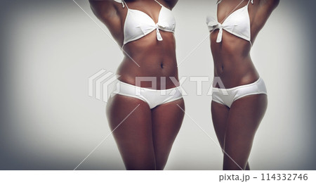 Transformation, weightloss and body of black woman on a gray background for diet, detox and wellness. Health, lose weight and stomach of isolated person for workout, exercise and fitness in studio Transformation, weightloss and body of black woman on a gray background for diet, detox and wellness. Health, lose weight and stomach of isolated person for workout, exercise and fitness in studio 114332746
