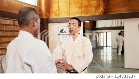 Aikido dojo, men and sensei for martial arts, learning or advice for combat at training, gym and class. Japanese people, moving hands or sport for fight, workout or fitness with zen, conflict or club Aikido dojo, men and sensei for martial arts, learning or advice for combat at training, gym and class. Japanese people, moving hands or sport for fight, workout or fitness with zen, conflict or club 114333237