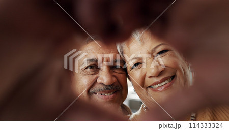 Happy, selfie and senior couple in a living room with heart, hands or frame zoom in their home together. Smile, portrait and elderly people bond in retirement with profile picture, memory or love Happy, selfie and senior couple in a living room with heart, hands or frame zoom in their home together. Smile, portrait and elderly people bond in retirement with profile picture, memory or love 114333324