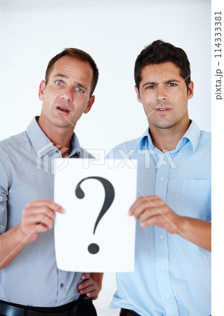 Confused, businessmen and question mark on paper for unsure, company and colleagues isolated on white background. Male people, professional and teamwork for workplace regulations, staff and studio. Confused, businessmen and question mark on paper for unsure, company and colleagues isolated on white background. Male people, professional and teamwork for workplace regulations, staff and studio. 114333381