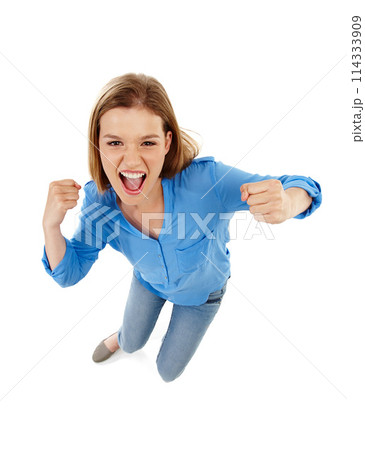 Woman, celebration and yes in studio for news or announcement of competition, giveaway or sale. Portrait of excited winner in top view with fist, wow and success or winning on a white background Woman, celebration and yes in studio for news or announcement of competition, giveaway or sale. Portrait of excited winner in top view with fist, wow and success or winning on a white background 114333909