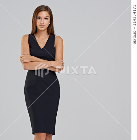 Businesswoman, portrait and confidence in studio for career as financial account, grey background or mockup space. Female person, face and company growth for small business, start up or development 114334171