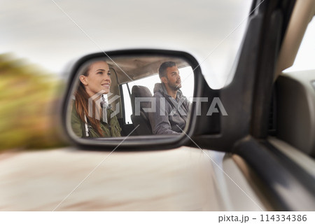 Couple, car and mirror on roadtrip with travel for adventure, vacation and reflection with happiness in countryside. Woman, man and driving in transport for holiday journey, tourism or honeymoon trip Couple, car and mirror on roadtrip with travel for adventure, vacation and reflection with happiness in countryside. Woman, man and driving in transport for holiday journey, tourism or honeymoon trip 114334386