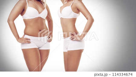 Transformation, lose weight and woman on a white background for diet, detox and wellness. Health, before after and stomach of isolated person in underwear for workout, exercise and fitness in studio 114334674