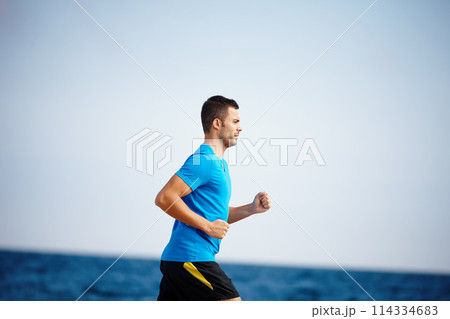 Running, athlete and man, water and outdoor with energy for practice, exercise and health in nature. Workout, runner and training for marathon, beach and performance of speed for sports and person Running, athlete and man, water and outdoor with energy for practice, exercise and health in nature. Workout, runner and training for marathon, beach and performance of speed for sports and person 114334683
